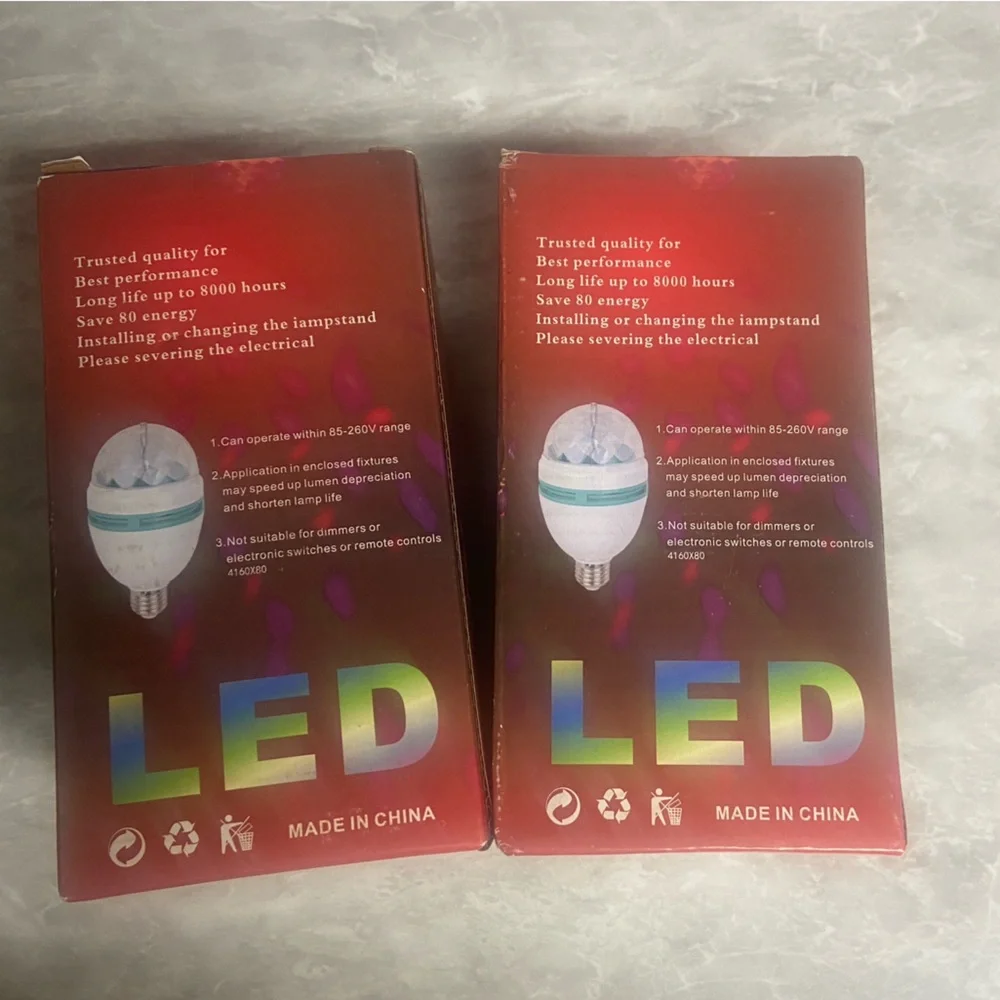 Two (2) pack RGB rotating LED light bulbs NIB